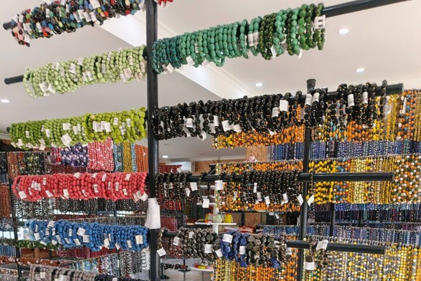 A store with shelves of colorful beads and jewelry. 4