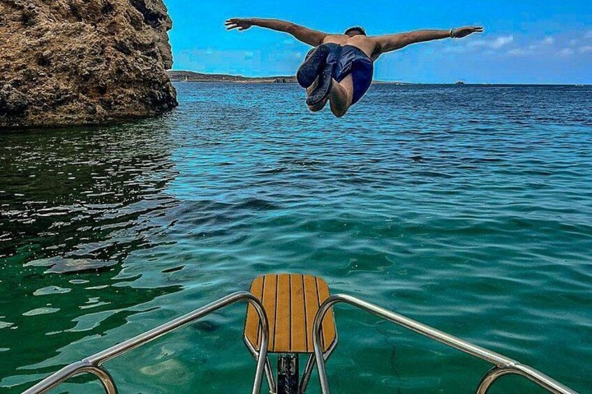 Feel the thrill of jumping or diving off the specially designed dolphin platform at the prow of the boat, straight into the crystal-clear waters of Blue Lagoon and Comino 4