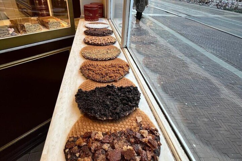 A display of various types of brownies in a bakery window. 1