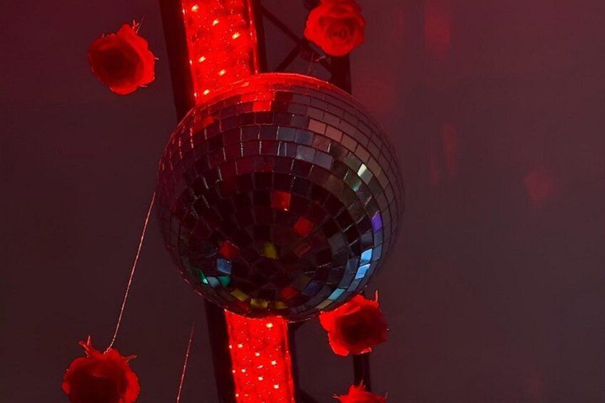 A disco ball with red roses. 3