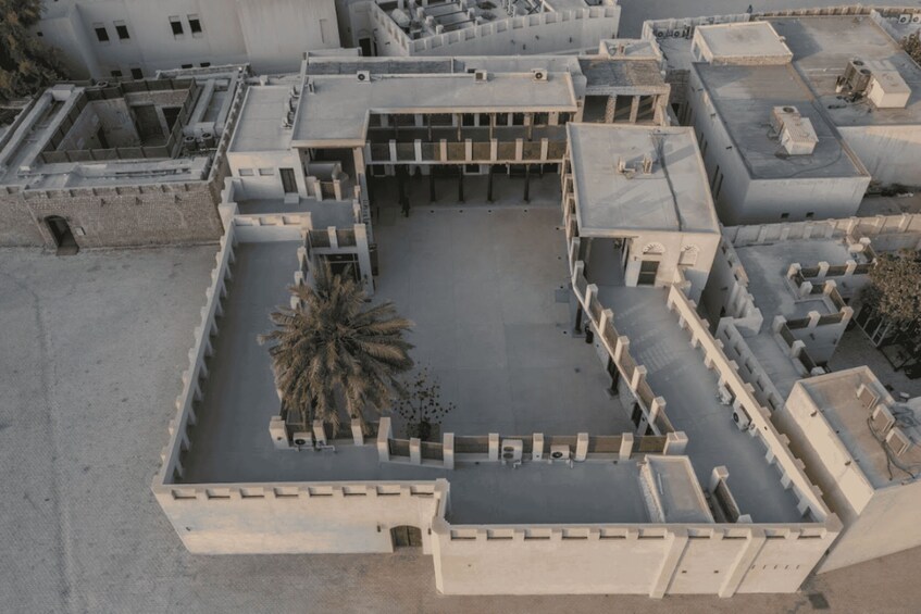 An aerial view of a historical fortress with multiple towers and walls. 3