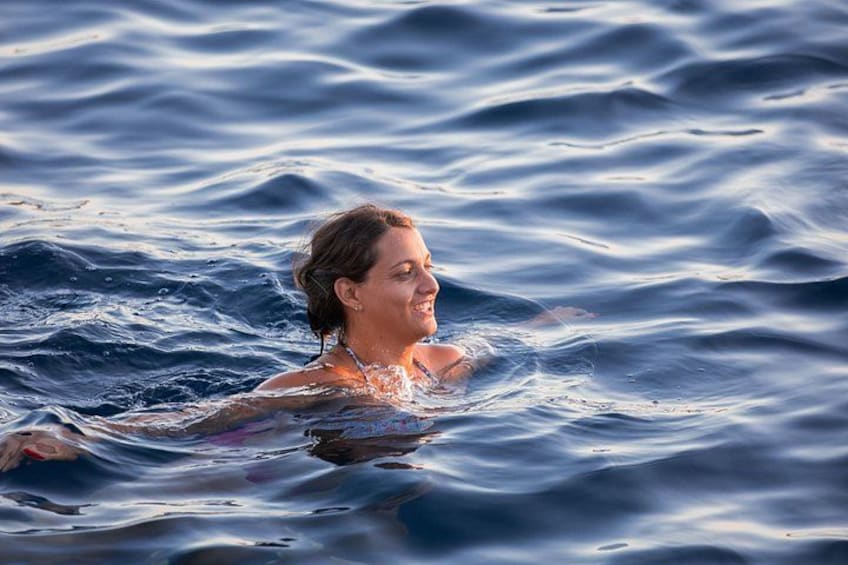 A person swimming in the ocean. 3