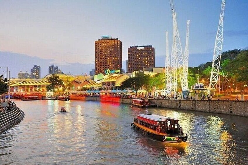 A river with boats, a bridge, and buildings in the background. 3