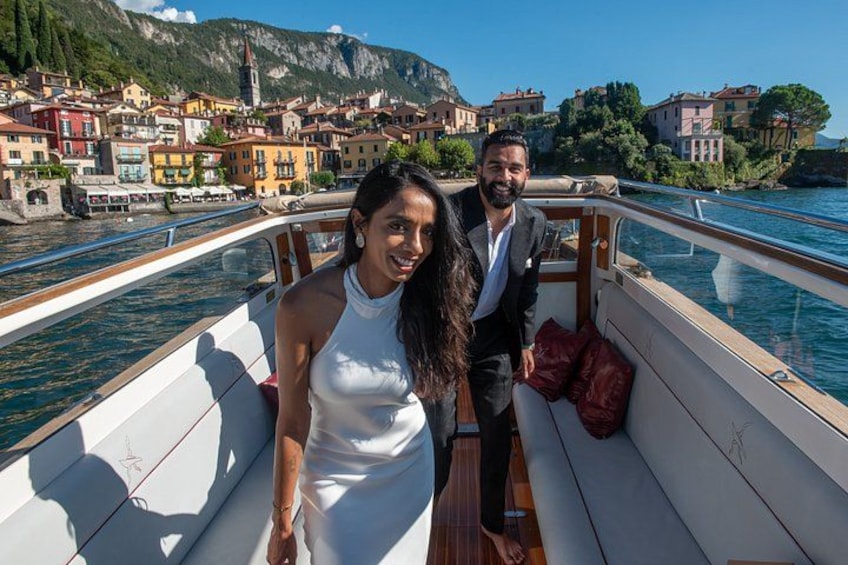 A boat on a river with a town in the background. 2