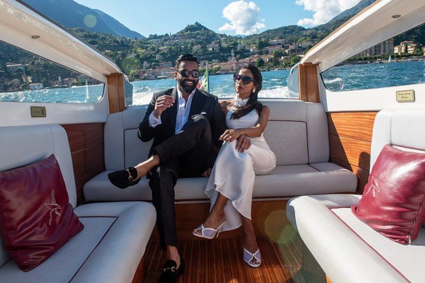 A couple on a boat with a mountainous landscape in the background. 5