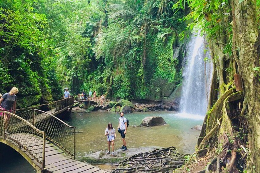 Trek to the stunning Ulu Petanu hidden waterfall, where beauty meets adventure. 3