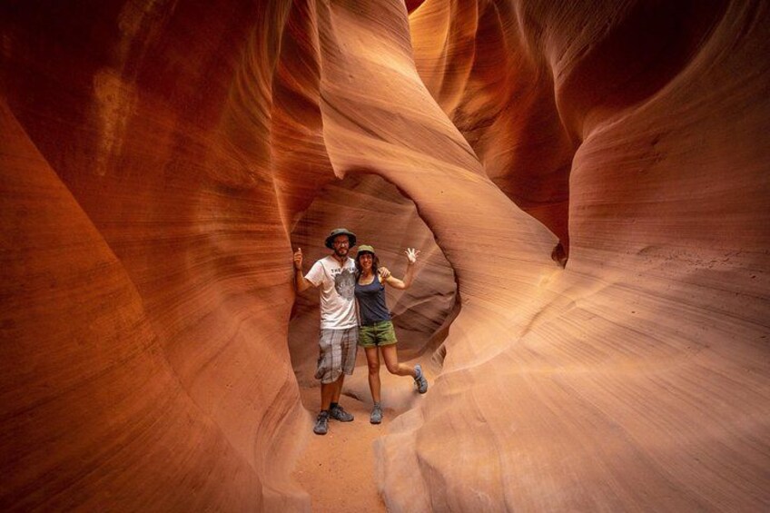 A canyon with smooth, curved rock walls and a narrow passageway. 2
