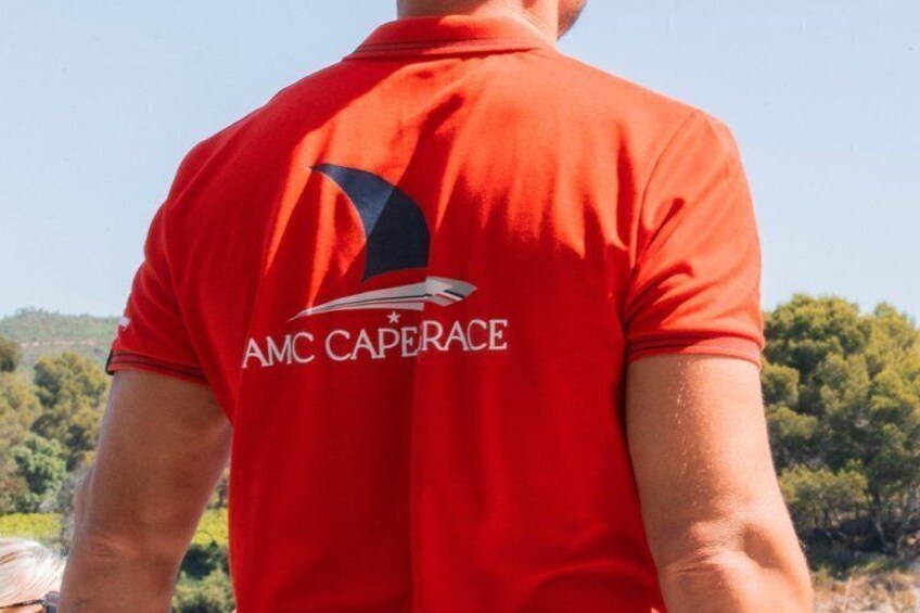 A person wearing a red shirt with 'AMC CAPERACE' on the back. 3