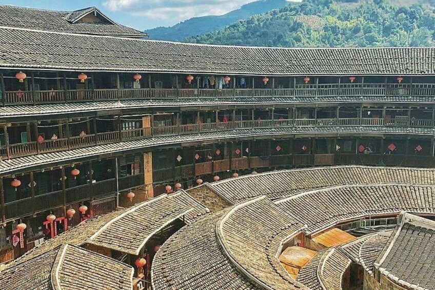 A traditional multi-tiered building with a circular courtyard. 2