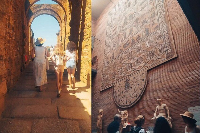 A narrow stone pathway with arches, a patterned wall, and a group of people observing a statue. 2