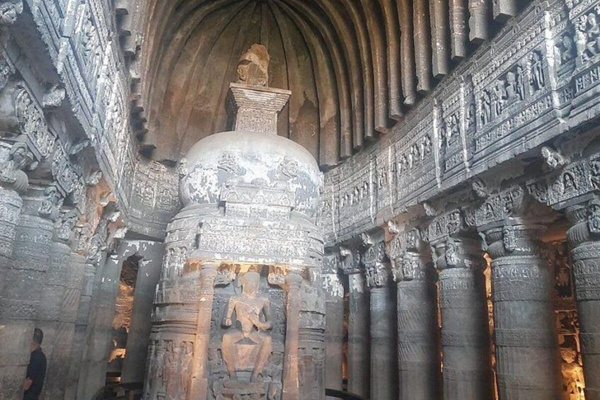 An intricately carved stone structure with detailed artwork and columns. 4