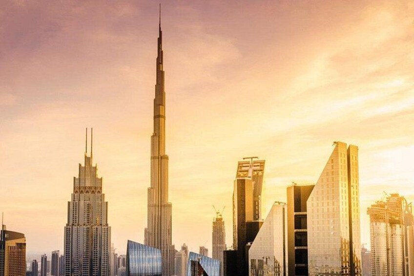 A city skyline with prominent skyscrapers, including a very tall building that stands out. 2