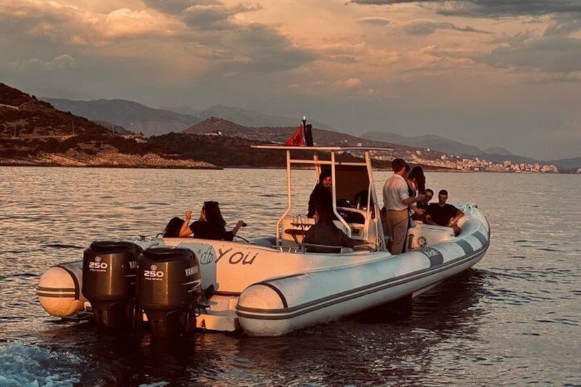A motorboat with 'You' written on the side, people on board, and a mountainous landscape in the background. 3
