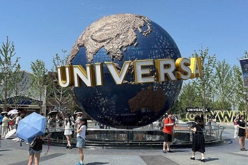 A large globe with 'UNIVERSAL' written on it. 1
