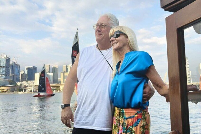 A couple enjoying the waterfront views and skyline during our Singapore River Cruise on the night tour. 3