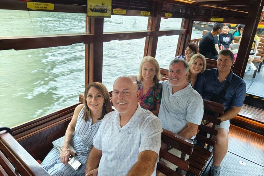 Guests enjoying the scenic Singapore River Cruise as part of our guided night tour experience. 4