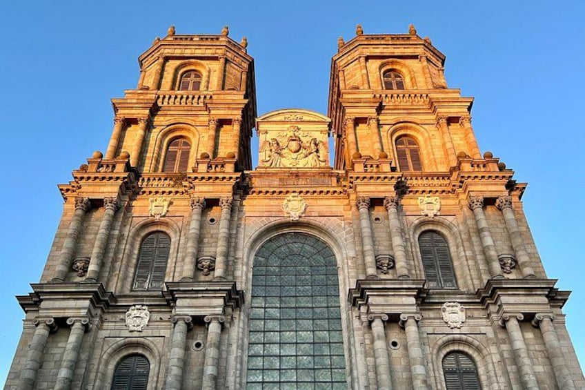 A large, ornate cathedral with two towers, a central arched window, and detailed sculptures. 5