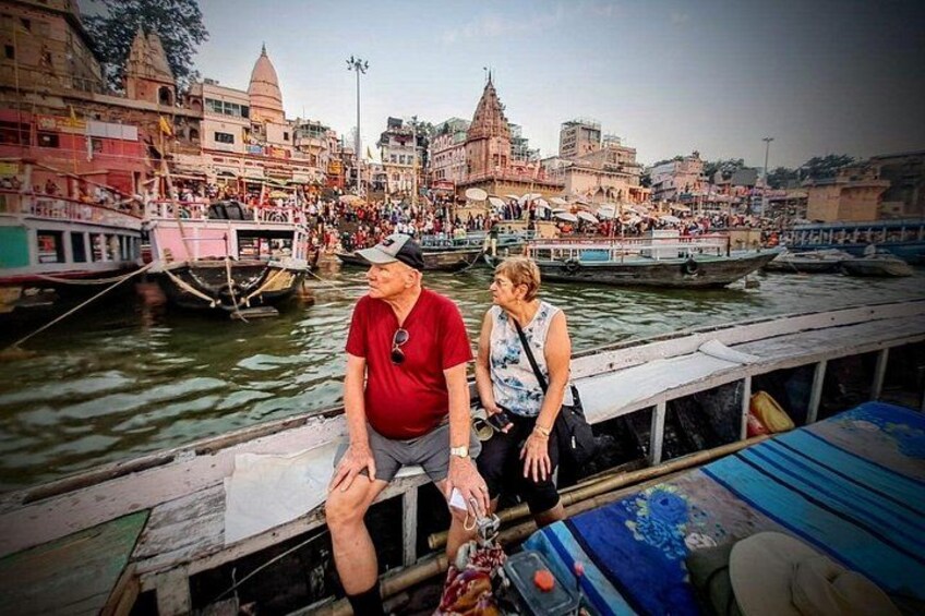 A river with boats, a bridge, and buildings in the background. 4