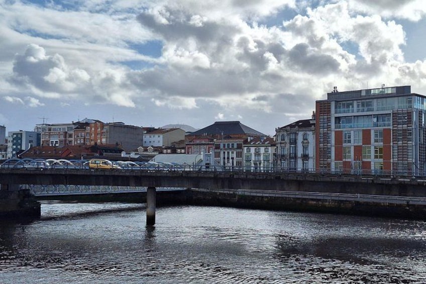 A bridge over a river with buildings on either side. 3