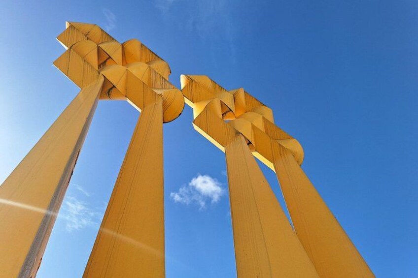 A tall, golden structure against a clear blue sky. 4