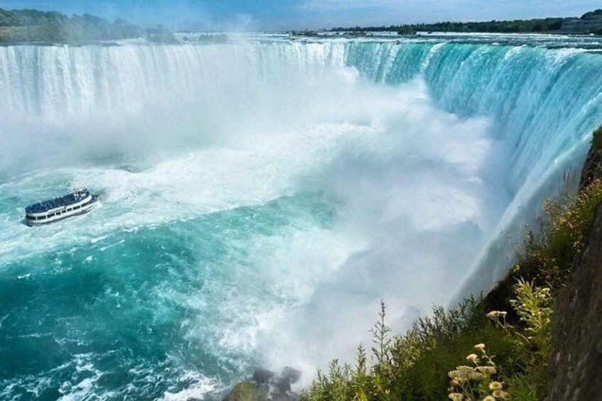 A boat navigating a large waterfall. 5