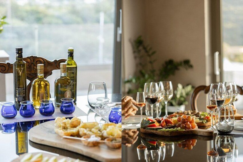 Una mesa servida con copas de vino, botellas y una variedad de platos. 2