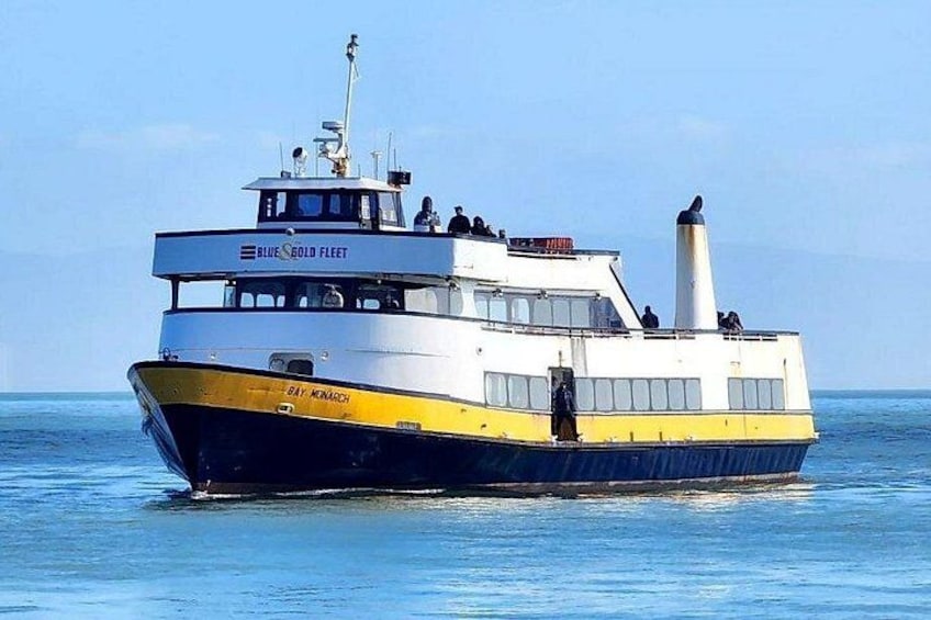 A ferry named 'Blue Gold Fleet' with 'Bay Monarch' written on the side, sailing on calm waters. 2