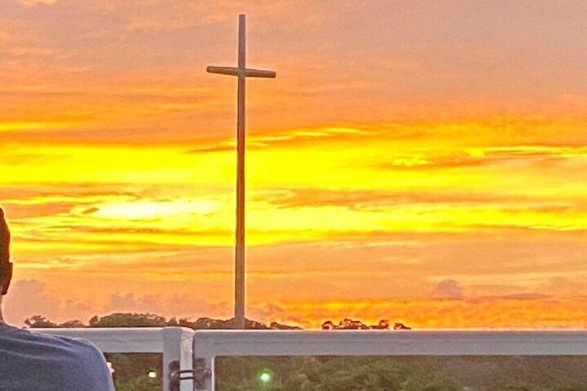A cross against a sunset sky. 2