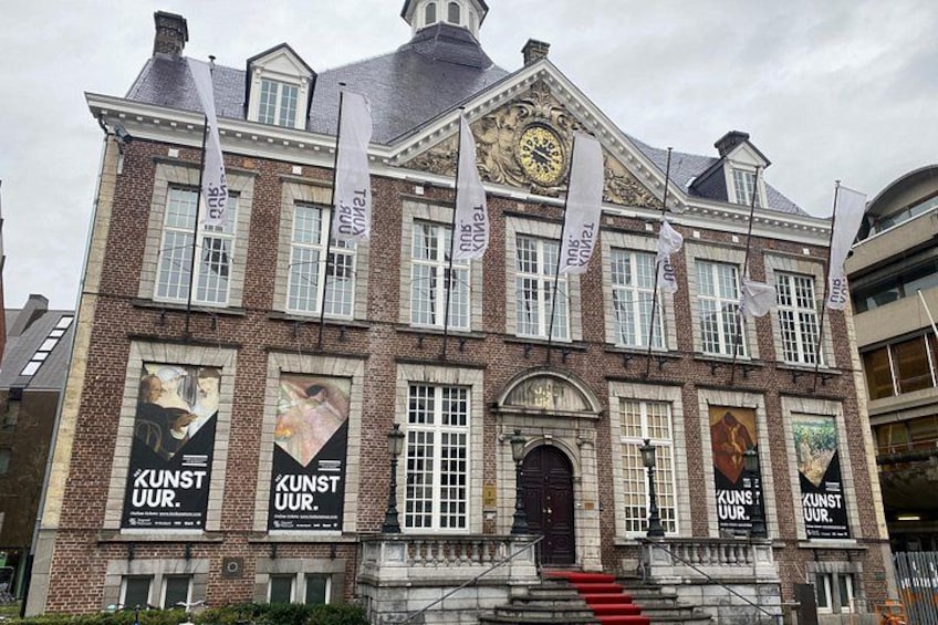A historic building with large posters and banners. 1