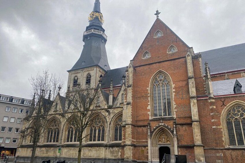 A historic church with a tall spire and arched windows. 2