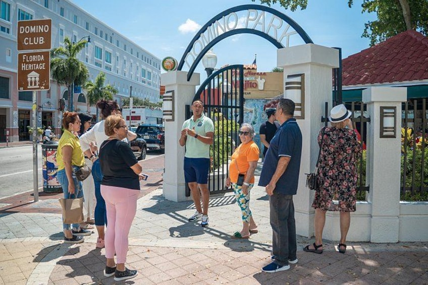 A group of people standing in front of a gated entrance with a sign that reads 'Florida Heritage.' 4