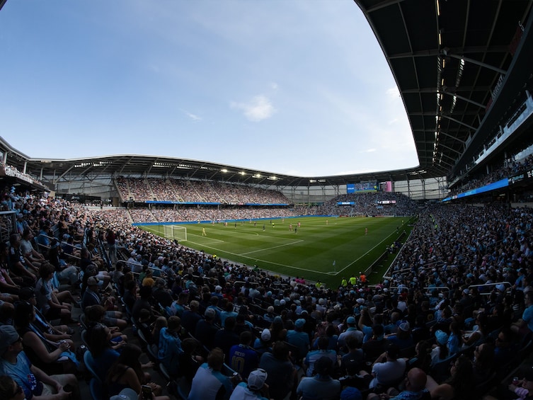 A large stadium filled with spectators. 1