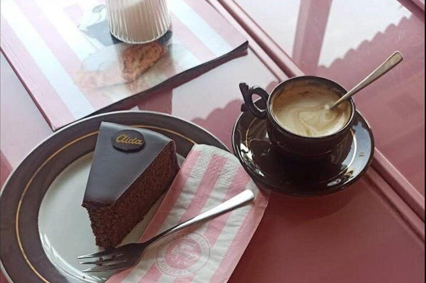 A slice of rich Sachertorte paired with a freshly brewed coffee—a perfect moment to indulge in Vienna’s sweet heritage during your gastronomic tour. 2