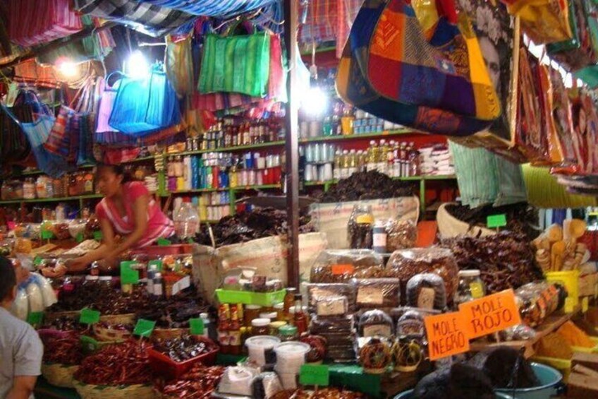 A market with various goods on display, including jars and bags of spices. 3