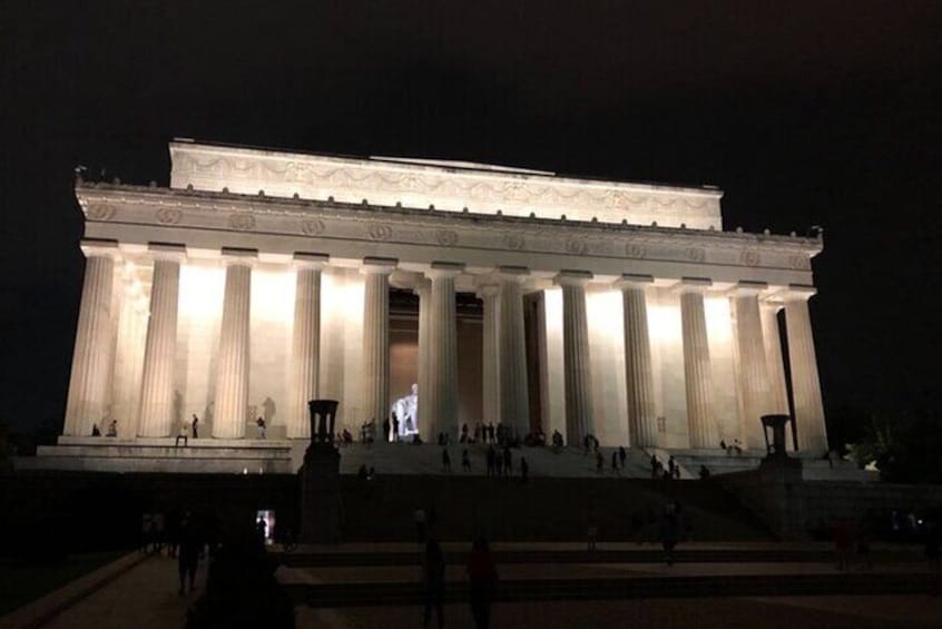 The Lincoln Memorial at night with illuminated columns and steps. 2
