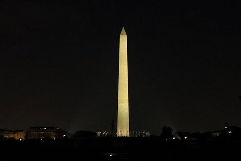 The Washington Monument illuminated at night. 3
