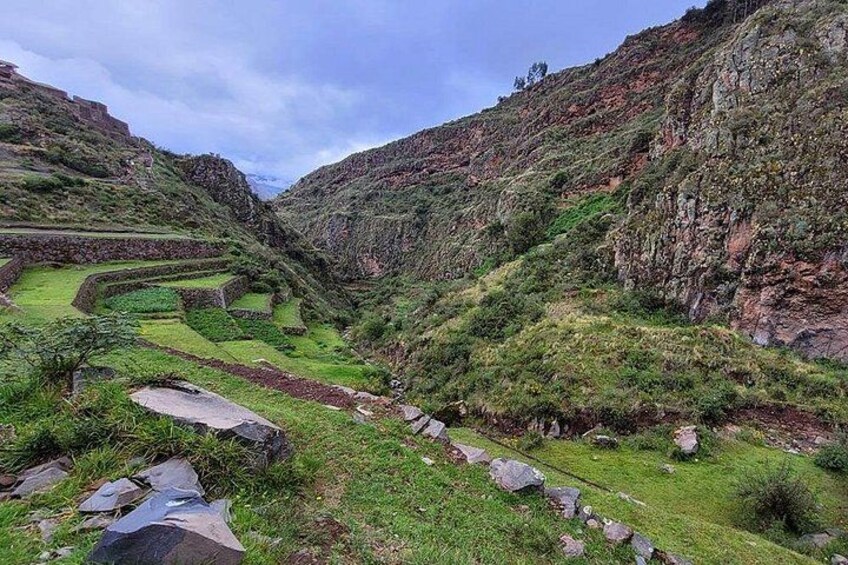 Terraced agricultural fields, rocky terrain, and a valley. 4