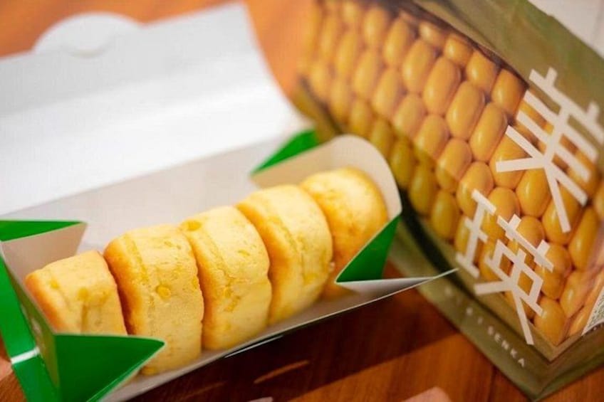 A packaged food item with a green label and a white box. 4