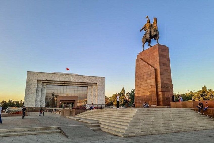 A large building with a statue of a person on horseback in front of it. 3