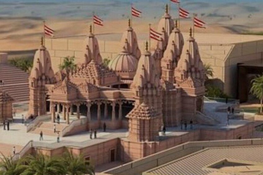 A model of a temple complex with multiple spires, flags, and a surrounding walkway. 1