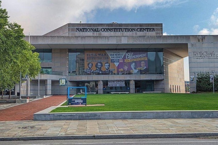 The National Constitution Center with a large mural and a grassy area in front. 3