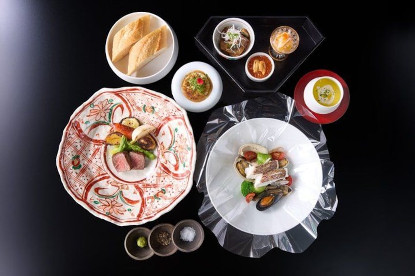 A variety of dishes on a table, including plates with meat, vegetables, and seafood, accompanied by bowls of sauces and bread. 4