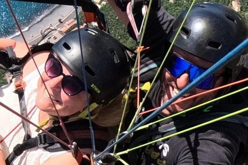 A person in a harness and helmet, with safety lines visible. 3