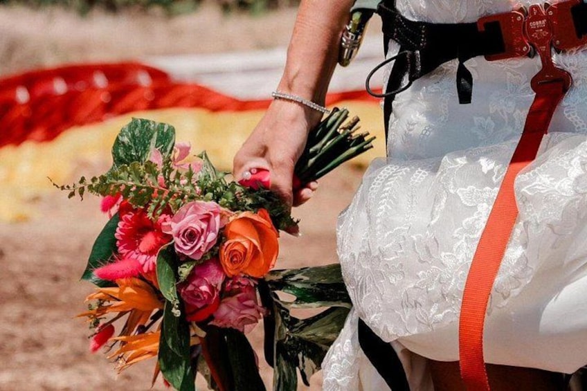 A person holding a bouquet of flowers. 5