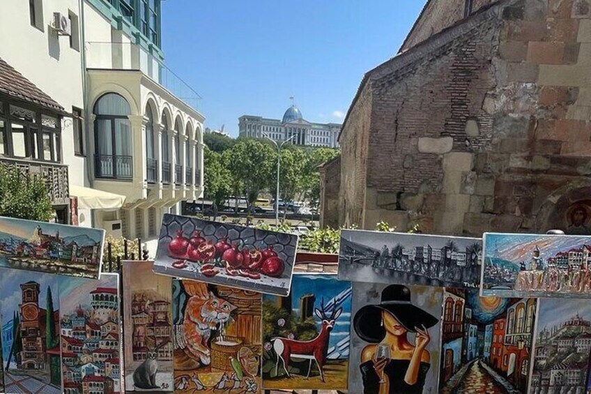 Outdoor murals on a building wall. 5