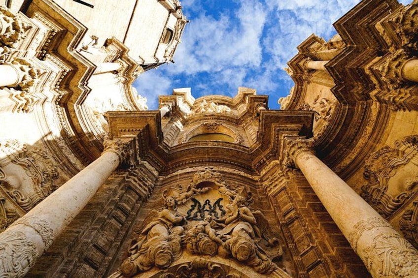 An ornate architectural structure with intricate carvings and columns. 1
