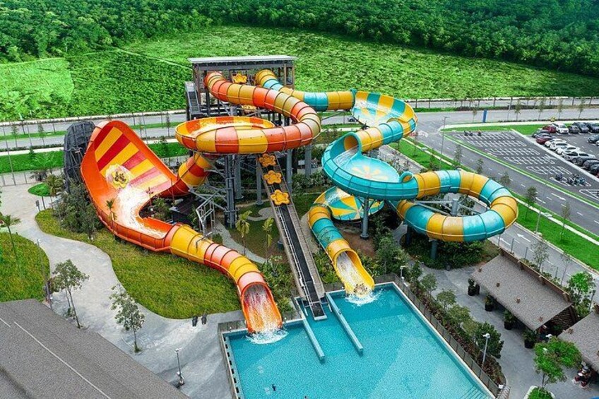 A water park with multiple slides and a pool. 4