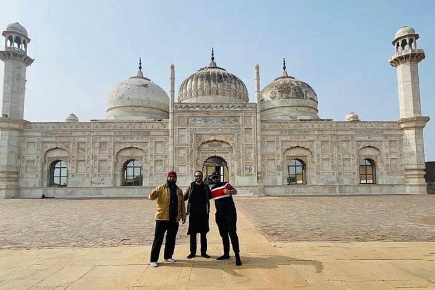 A large, historic building with domes and minarets. 3