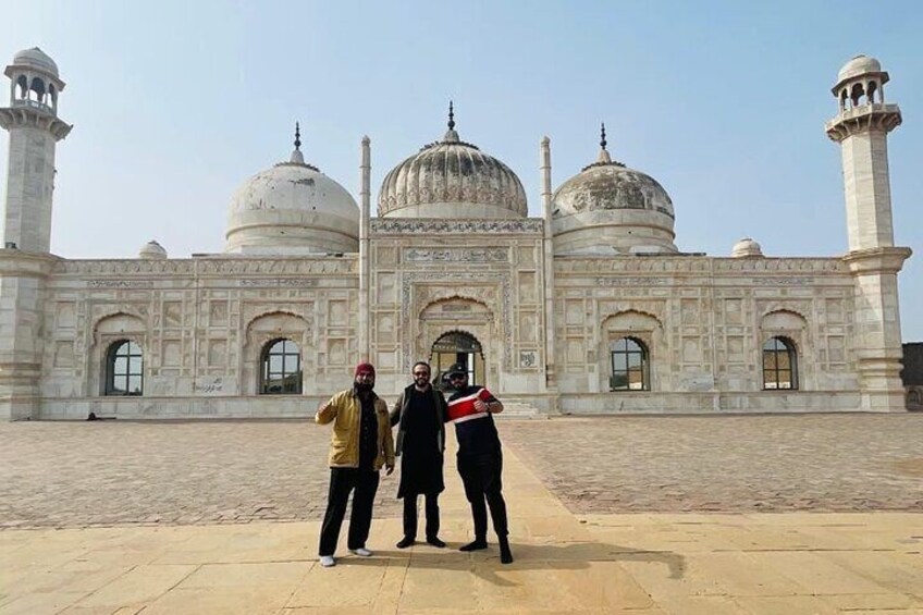 A large white building with domes and minarets. 3
