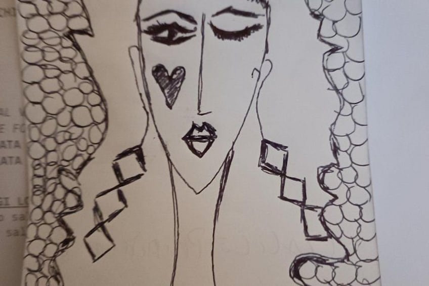 Un dessin représentant une personne avec des yeux en forme de cœur et un motif géométrique sur ses vêtements. 5